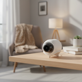 Mini Smart Indoor WiFi Camera on a living room shelf