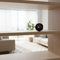 Compact WiFi Camera with Night Vision on a bookshelf